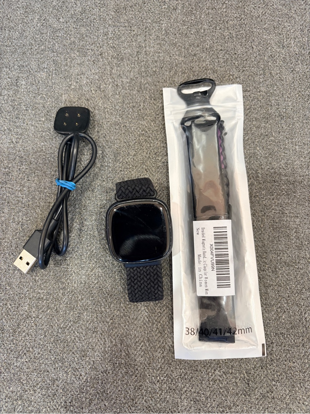fitbit Black Smartwatch Versa 4 with Braided Nylon Band and Extra Band